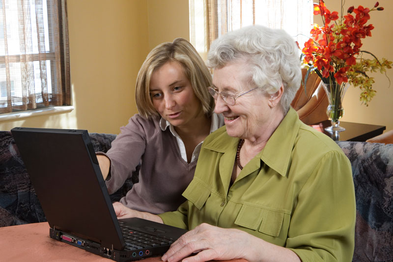 mother and daughter on computer