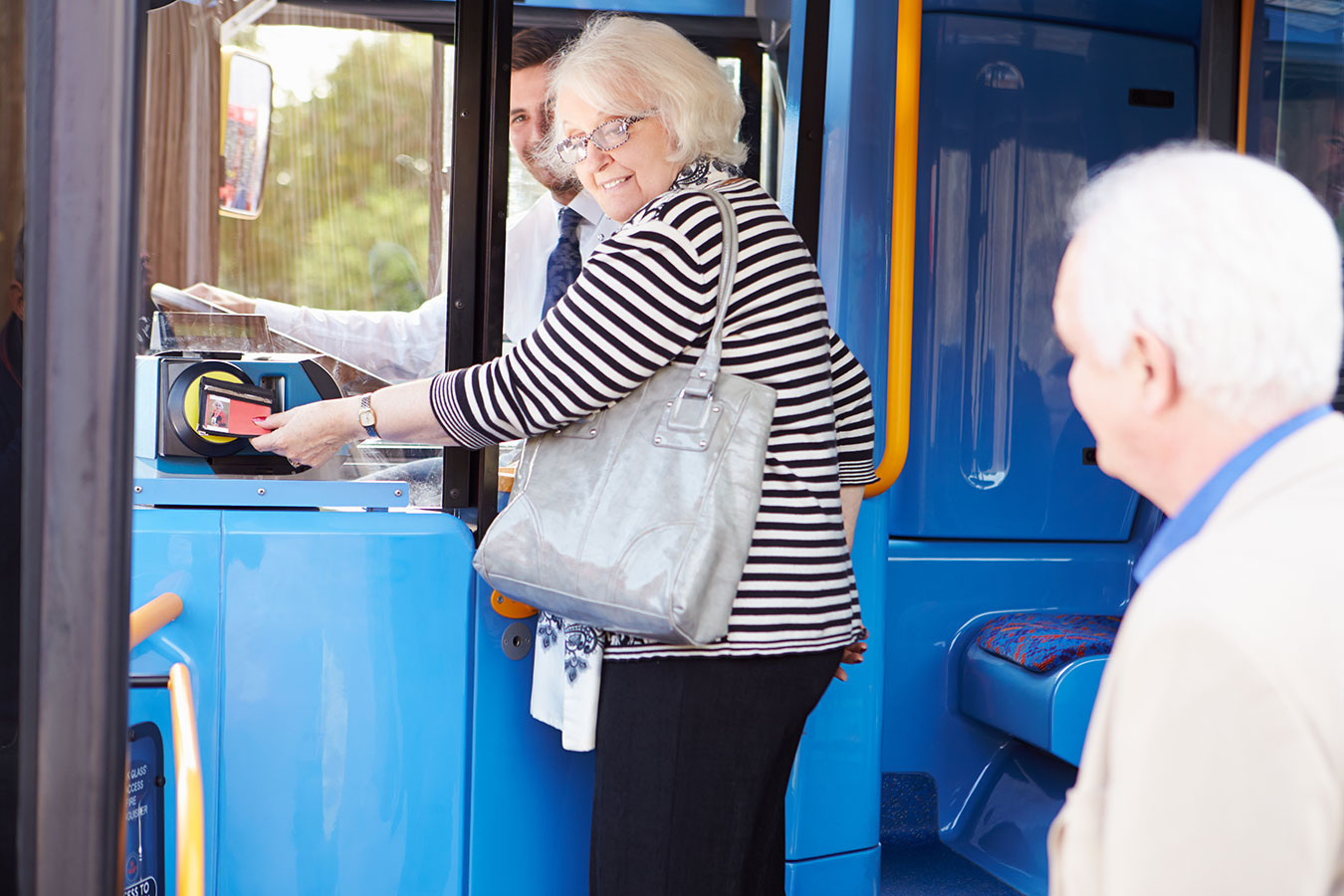 seniors getting on a bus