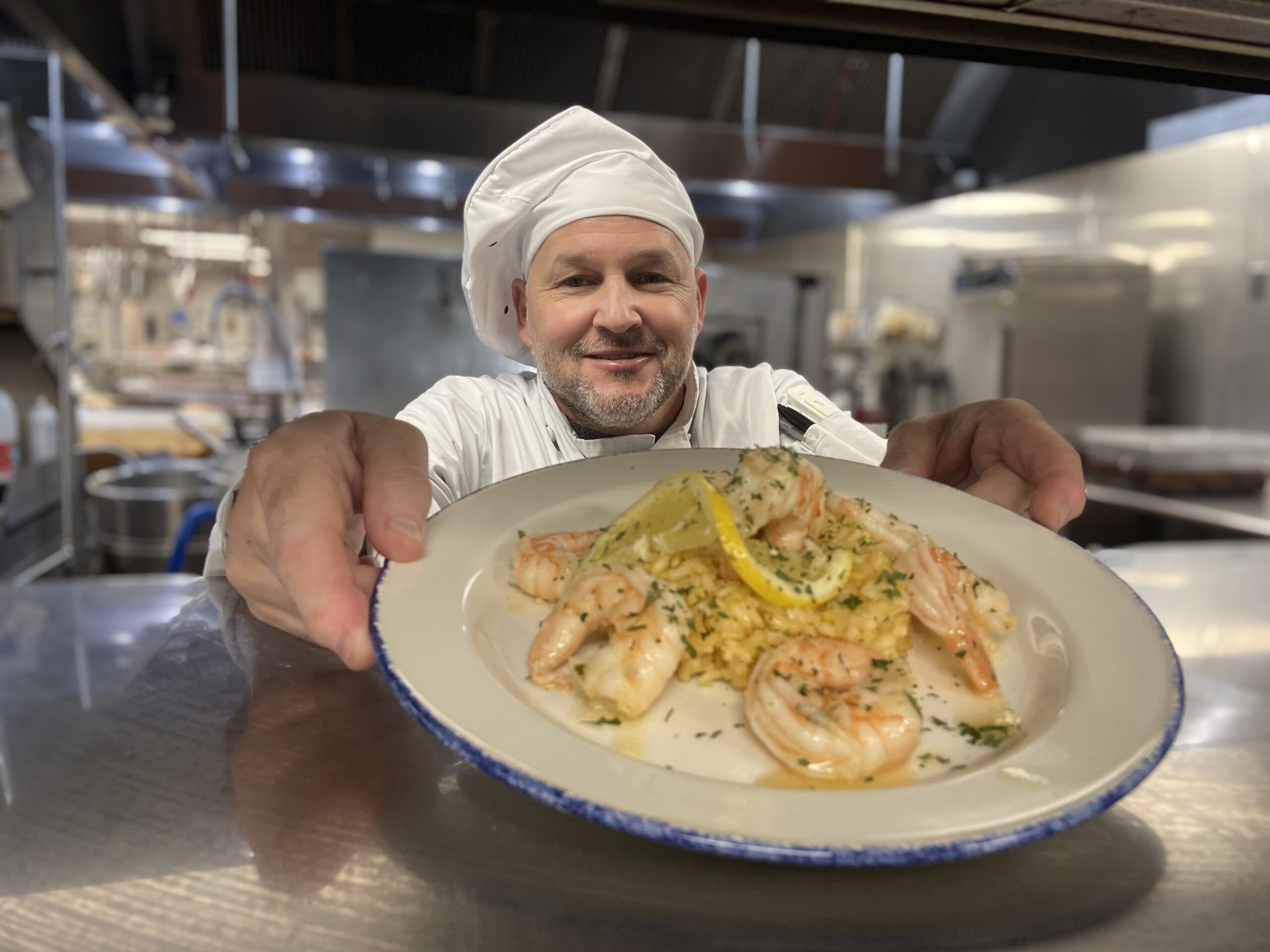 chef serving plated meal