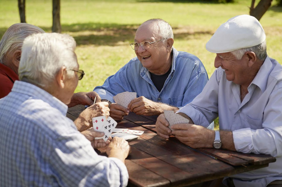senior men playing cards