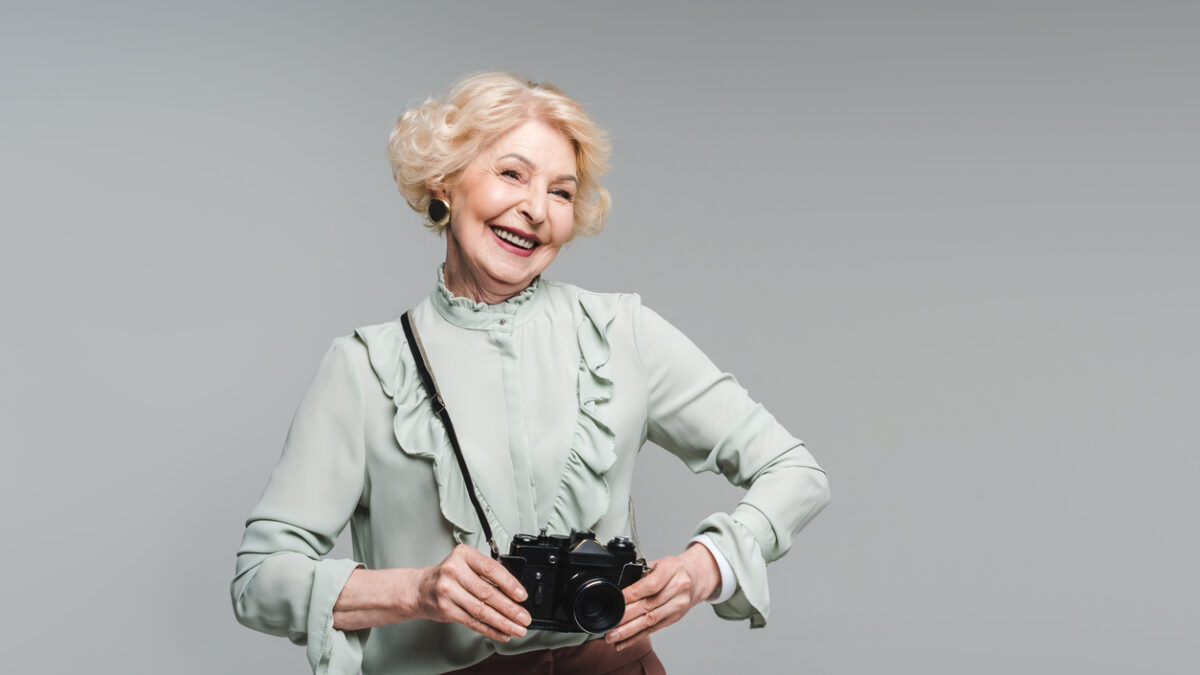 senior woman with camera