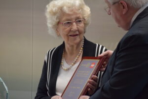 Mrs. Sever holding Rotary Club award