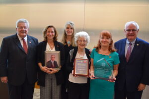 Dr. Sever's family with his awards and recognitions.