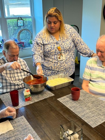 Ingleside Engaged participants making Lasagna with staff.