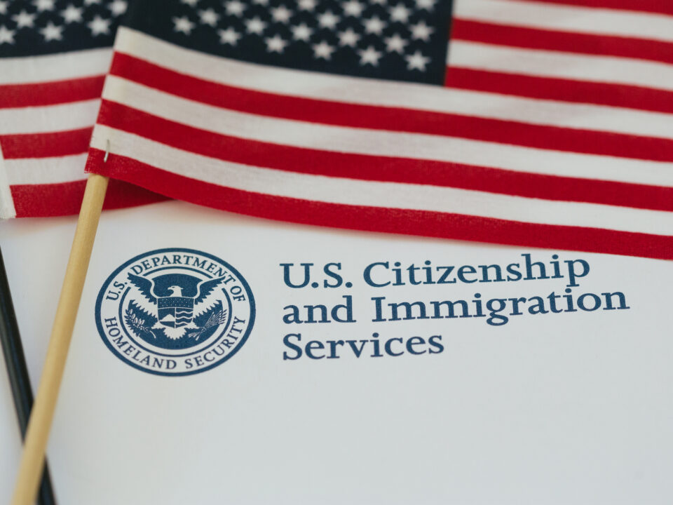 U.S. flag and citizenship and immigration paperwork