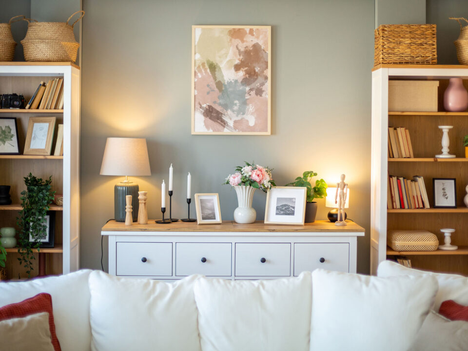 Stylish and cozy living room with bookshelves, a comfortable sofa, and tasteful decorations