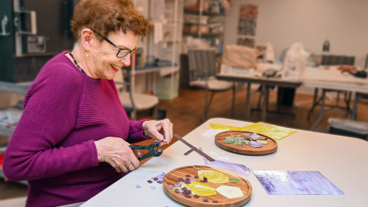Ingleside at Rock Creek resident working on a handcrafted glass art project.