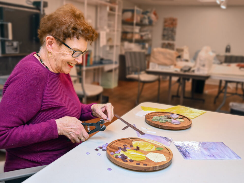 Ingleside at Rock Creek resident working on a handcrafted glass art project.