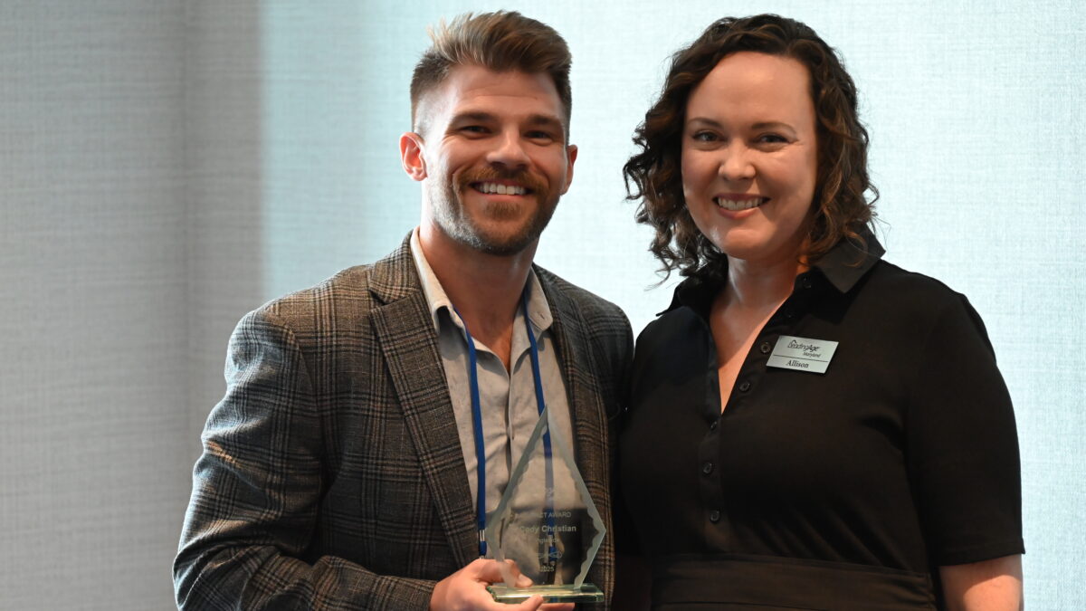 Cody receiving his award from Alison Ciborowski, President & CEO of LeadingAge Maryland.