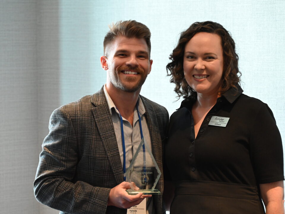 Cody receiving his award from Alison Ciborowski, President & CEO of LeadingAge Maryland.