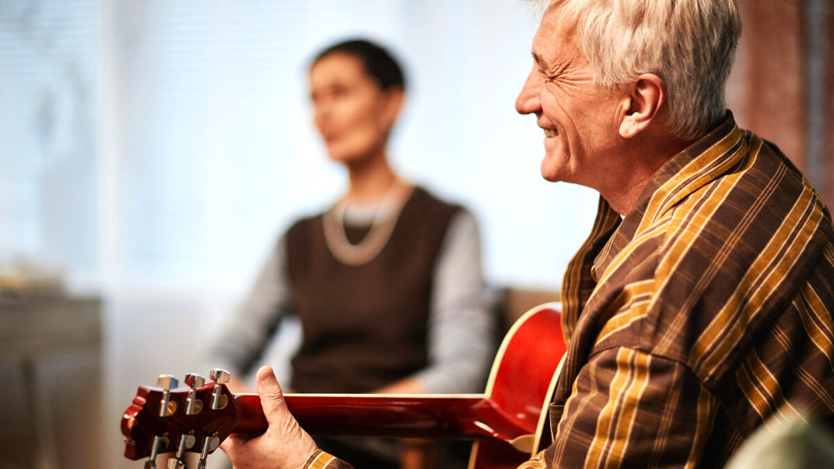 Man playing acoustic guitar